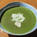 green nettle creamy soup in a bowl