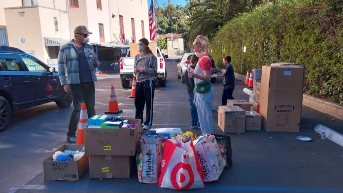 volunteers prepare donations for LA wildfire victims