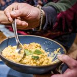 table with bowls and plates of food