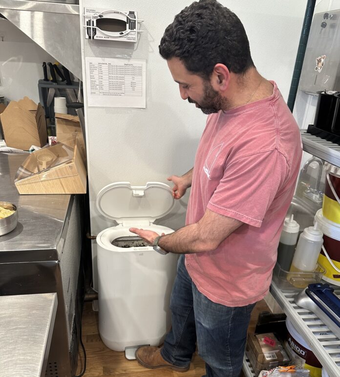 person with food recycler