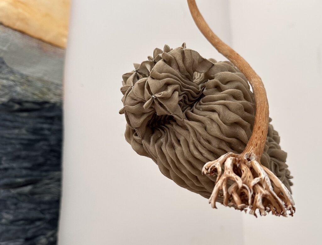 a sculpture that looks like a shell made by Ingrid Larssen