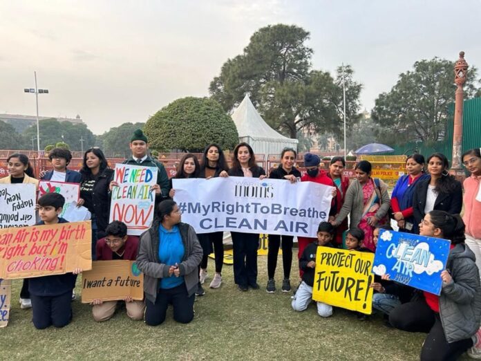 a group of climate activists in new delhi, india advocate for clean air