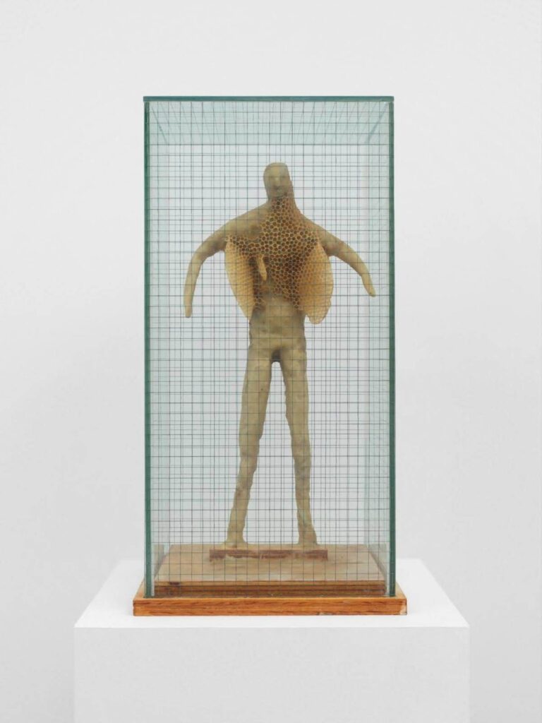 a steel beeswax sculpture made into the shape of a man