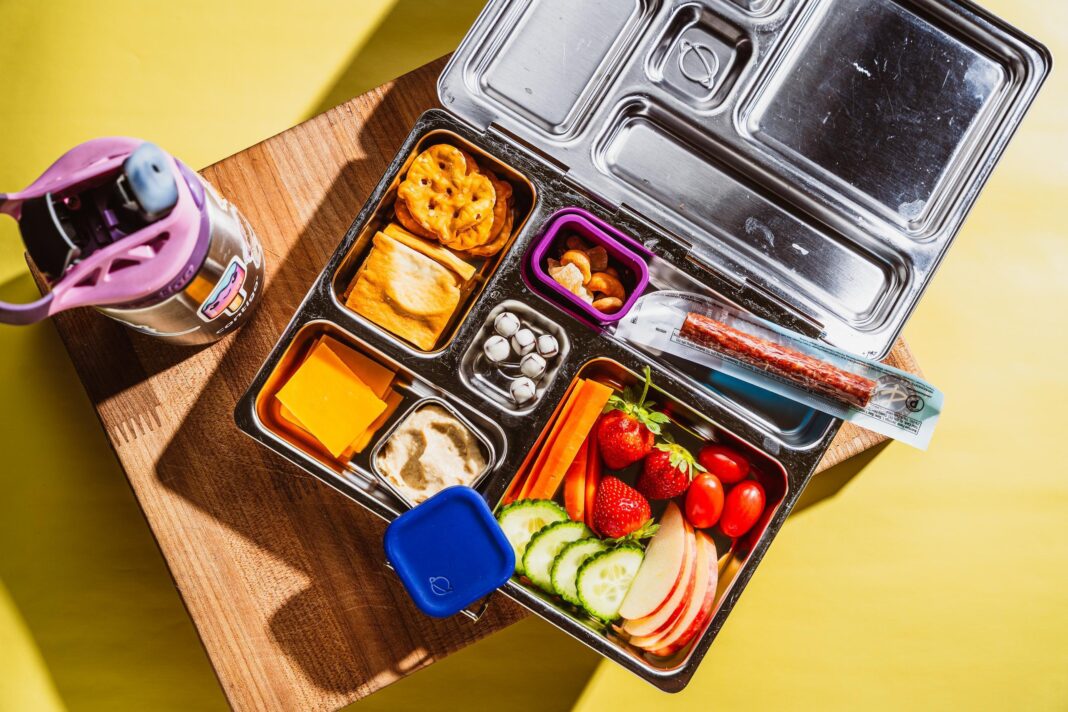 a colorful lunchbox filled with healthy food