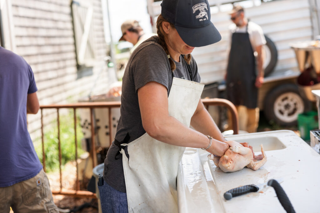 julie scott cleaning out a chicken