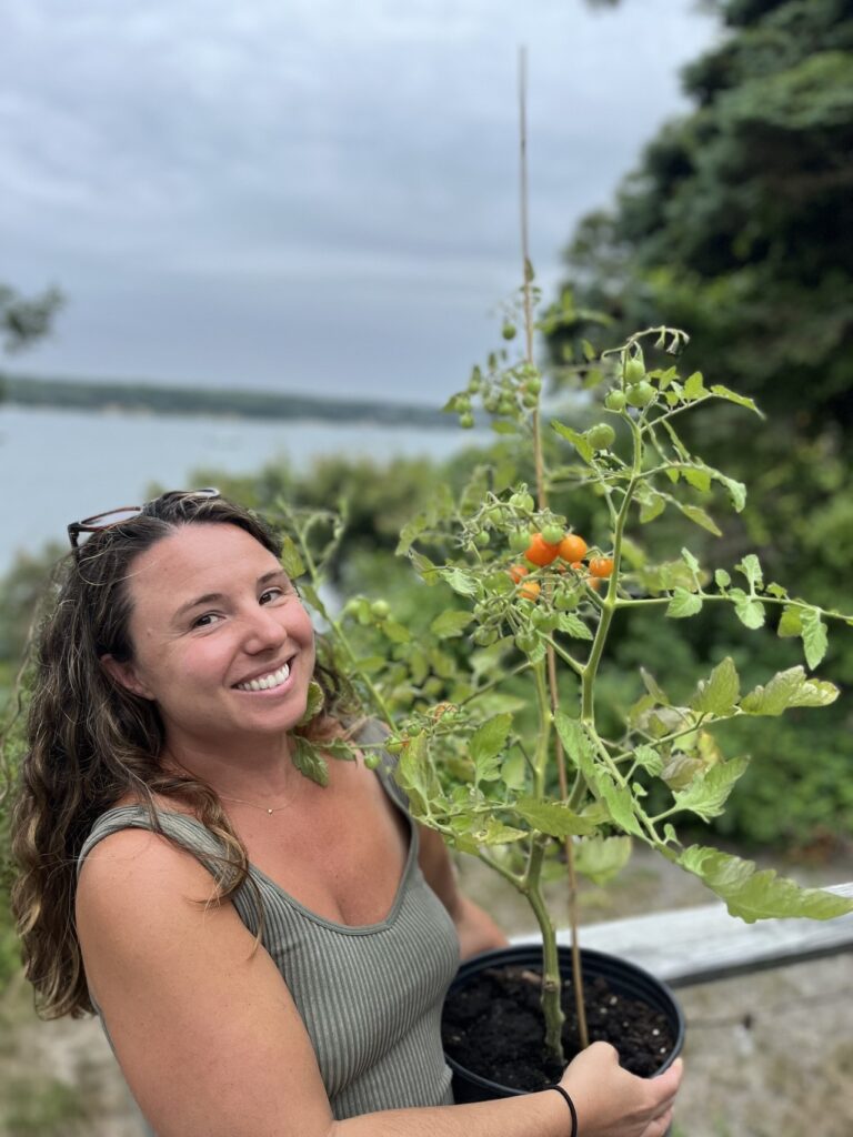 Whitney Multari with Tomato Plant from Lydia Fisher's Tomato Pruning Class