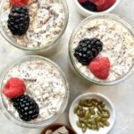 porridge served in bowls topped with berries