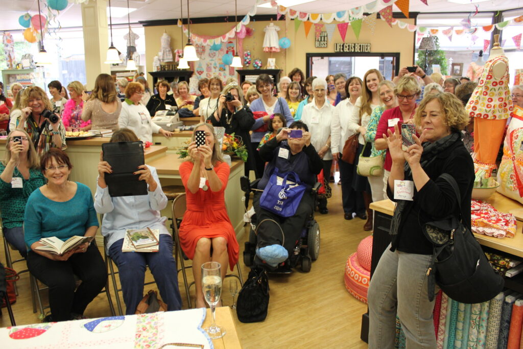 a room full of woman attending a book signing