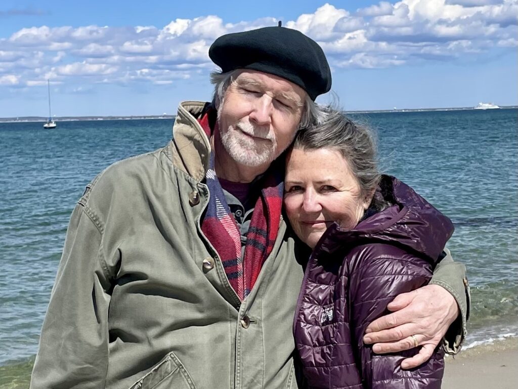 an older couple at the beach on a sunny day