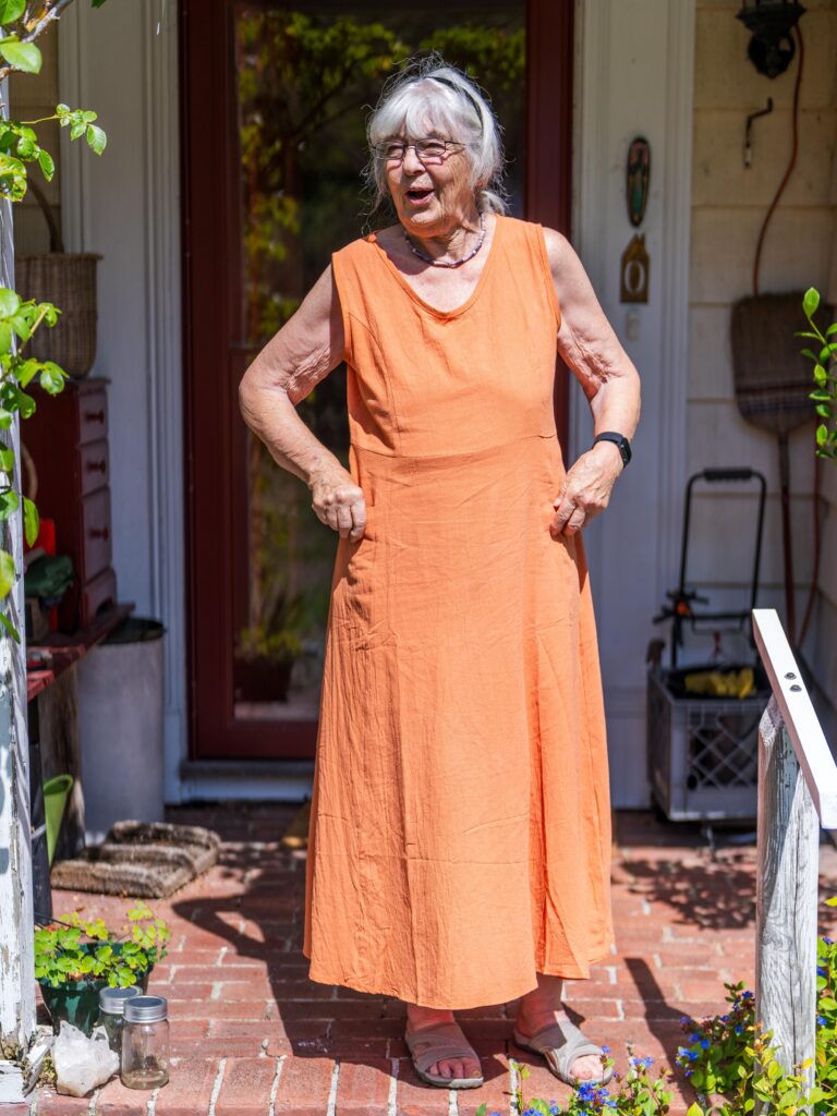 anna edey in front of her house