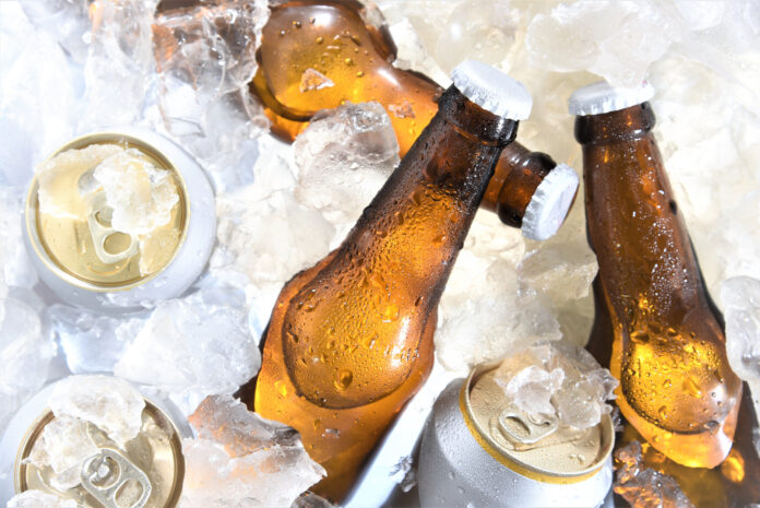 beer bottles and cans over on ice