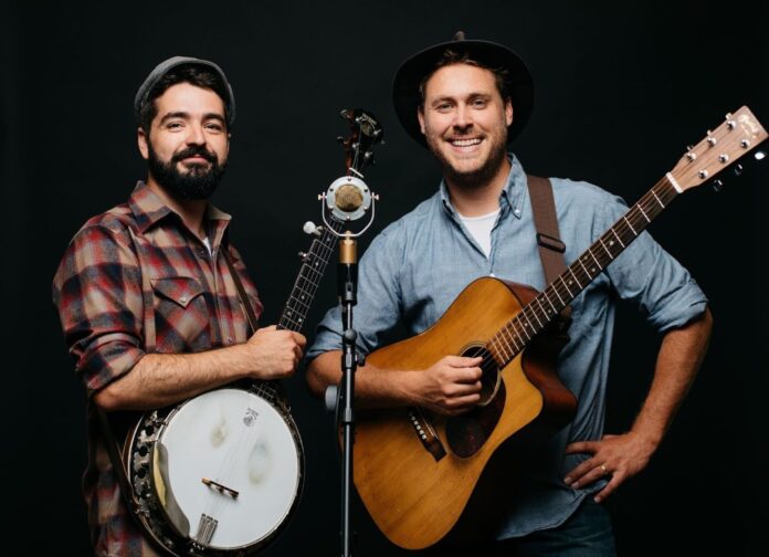 Justin Lansing and Joe Mailander pose with their instruments