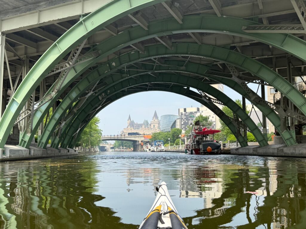 the view under a bridge on the rideau canal