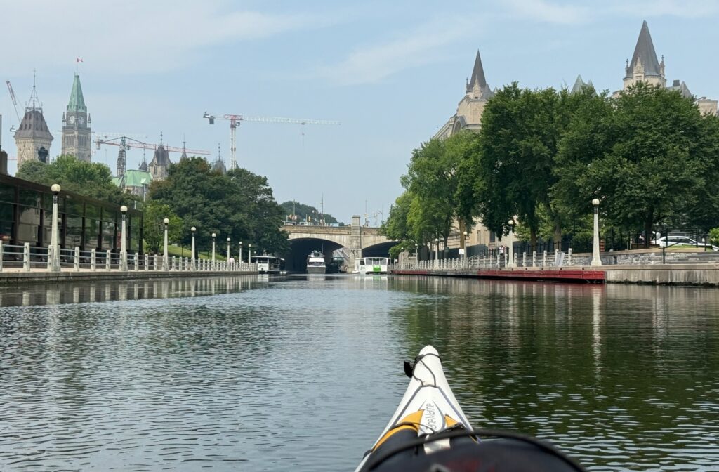 a view of the peace tower from the rideau canal