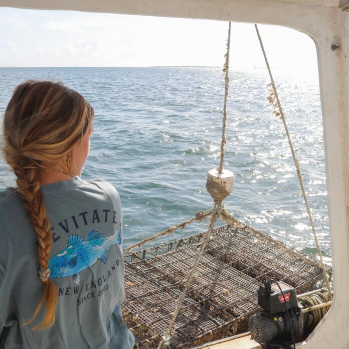 a young woman driving a boat