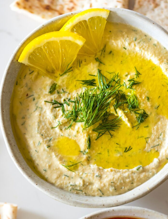 lemon dill hummus served in a bowl
