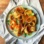 carrot ribbons with toasted walnuts and a carrot-top and lemon pesto dressing
