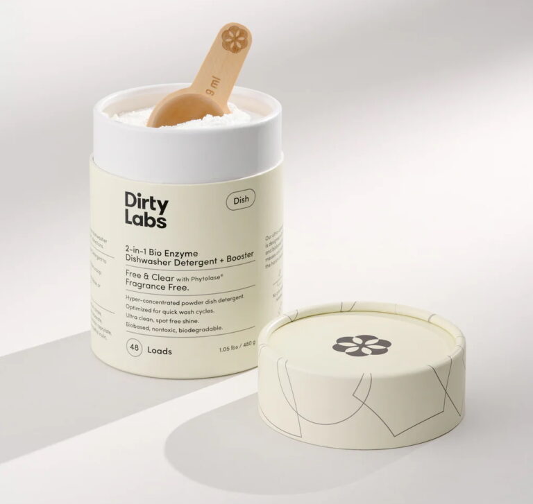 An open cardboard tube of dishwashing detergent powder from the brand Dirty Labs.