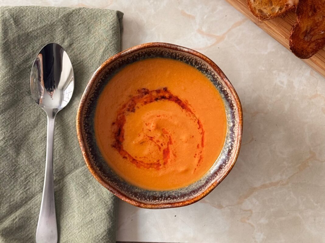 carrot soup served warmly in a bowl