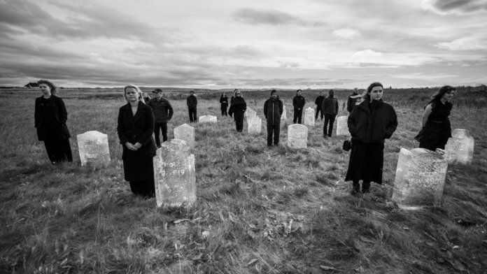 people attend a funeral for a glacier