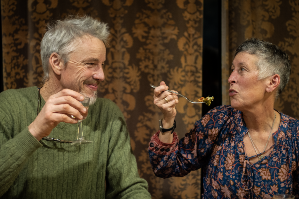 a man and woman eating at north tabor farm