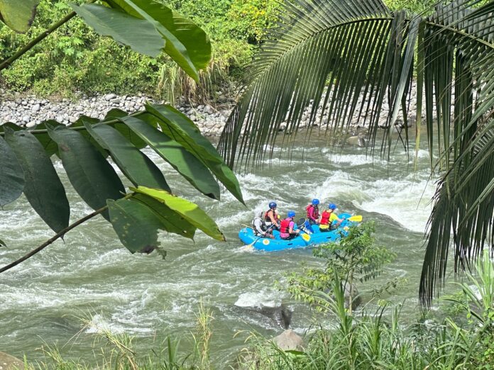 people on a raft going down a river