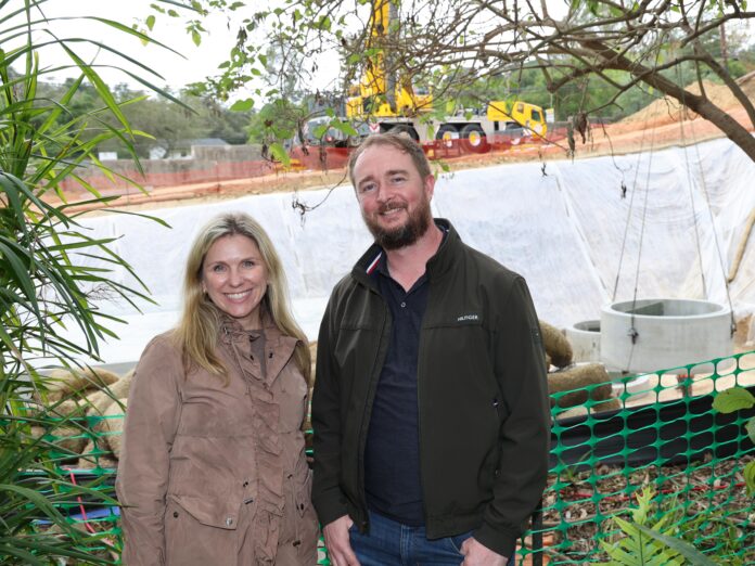 lotusland ceo, rebecca anderson, stands in front of construction