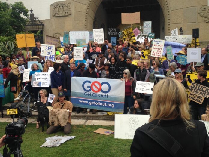 get oil out! (goo!) protestors