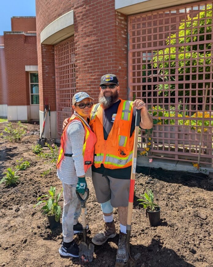 two volunteers at a MiniNature Reserve installation