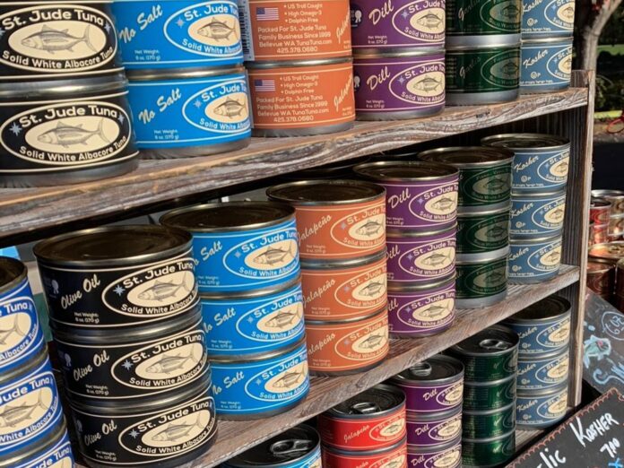 tuna cans on shelves at the store