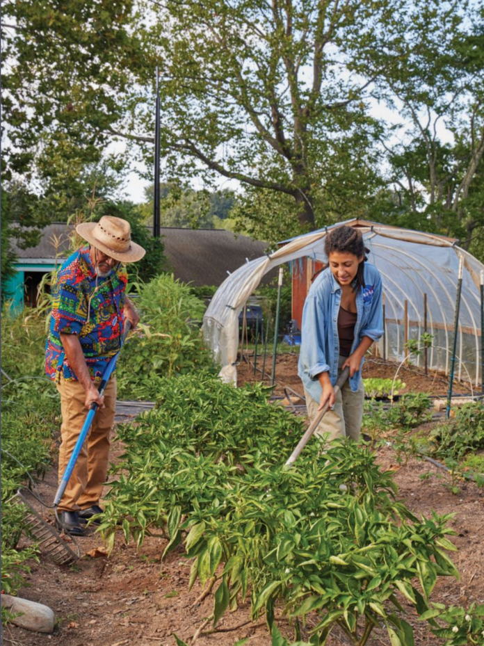 two people tending a garden together