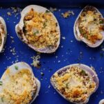 clams cracktino on a blue tray