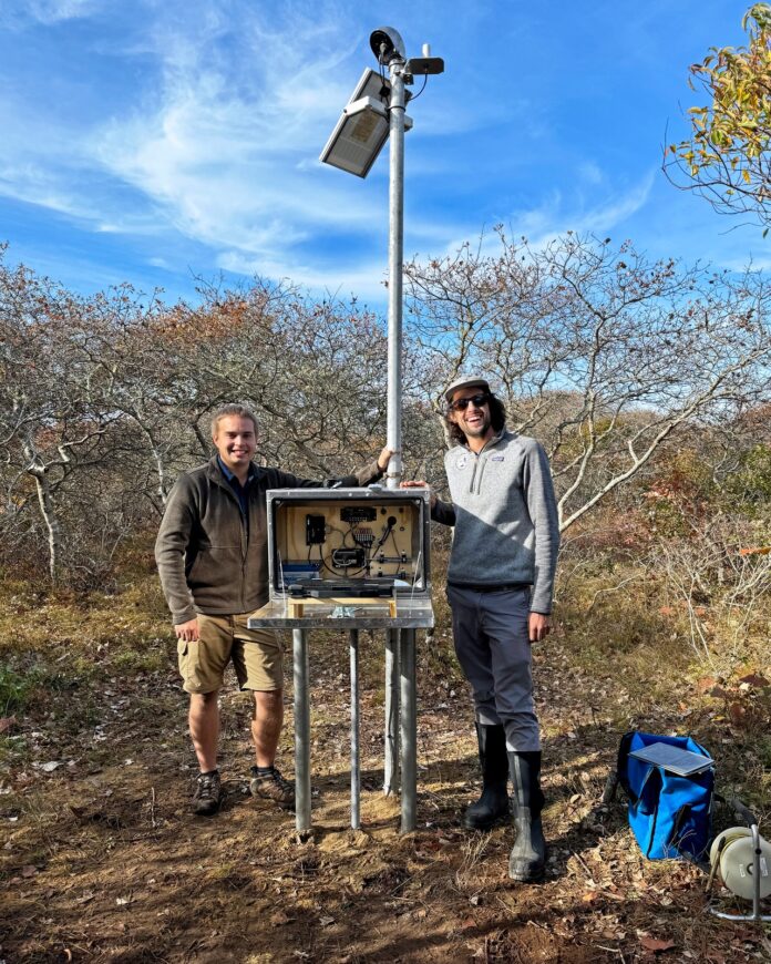 RJ Turcotte, right, with Sam Banas, and a newly installed, solar-powered sheltered groundwater gauge