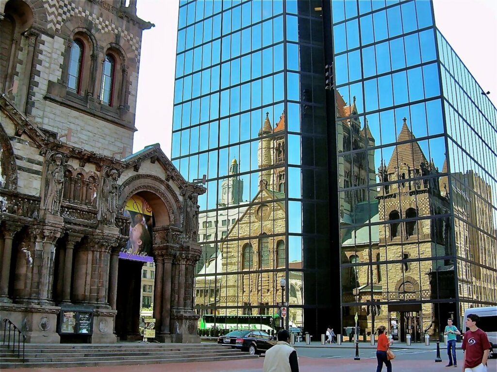trinity church reflected in the mirrored glass of the john hancock tower, boston