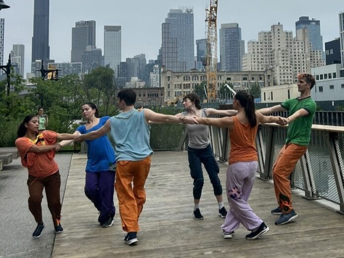a group of dancers performing outside