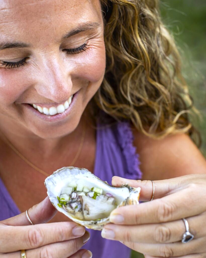 whitney enjoys an oyster