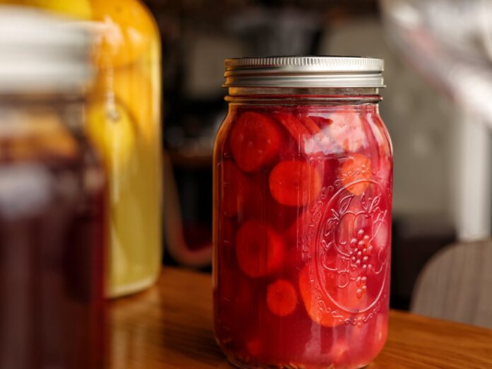 a major jar filled with fermented fruit