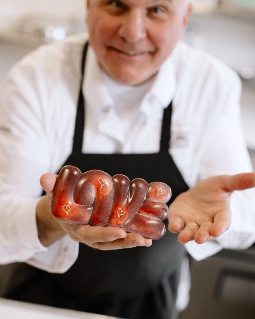 Andre Marrero and one of his chocolate creations
