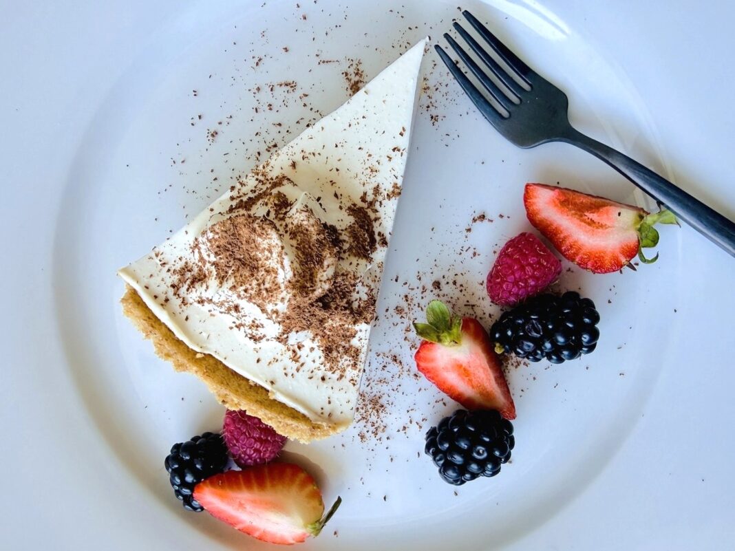 silken tofu cheesecake plated served with a side of berries