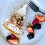 silken tofu cheesecake plated served with a side of berries