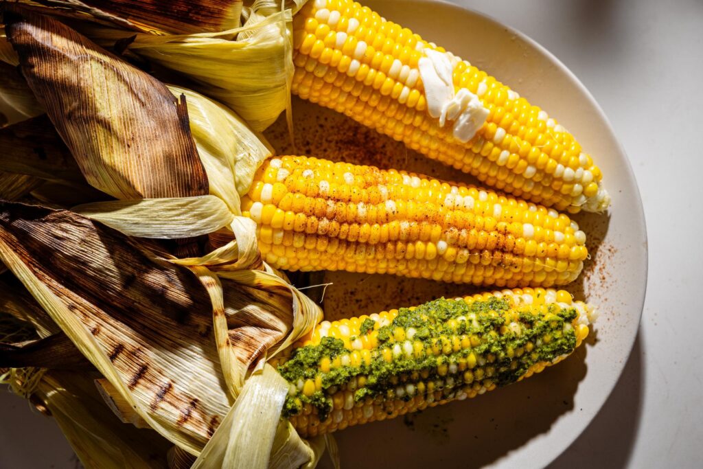 corn on the cob with different toppings