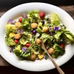 Summer Salad With Pansies, Peas, Strawberries, and Fried Goat Cheese in a Honey Vinaigrette