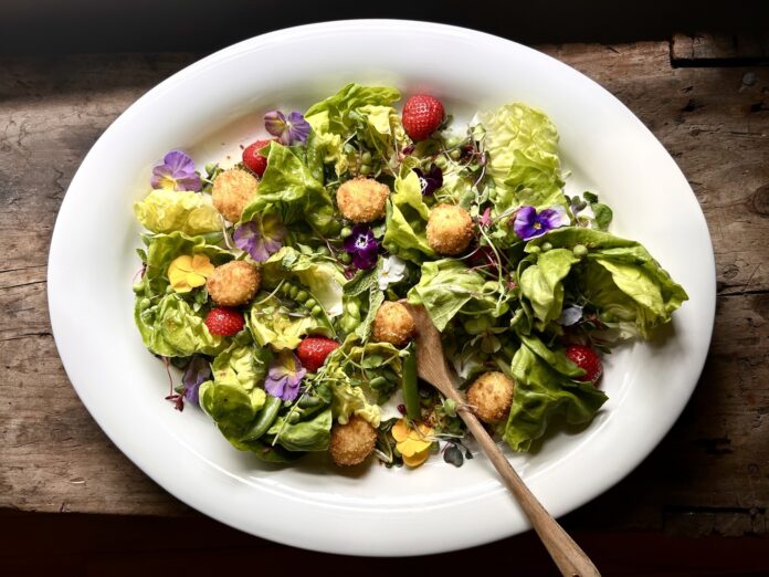 Summer Salad With Pansies, Peas, Strawberries, and Fried Goat Cheese in a Honey Vinaigrette