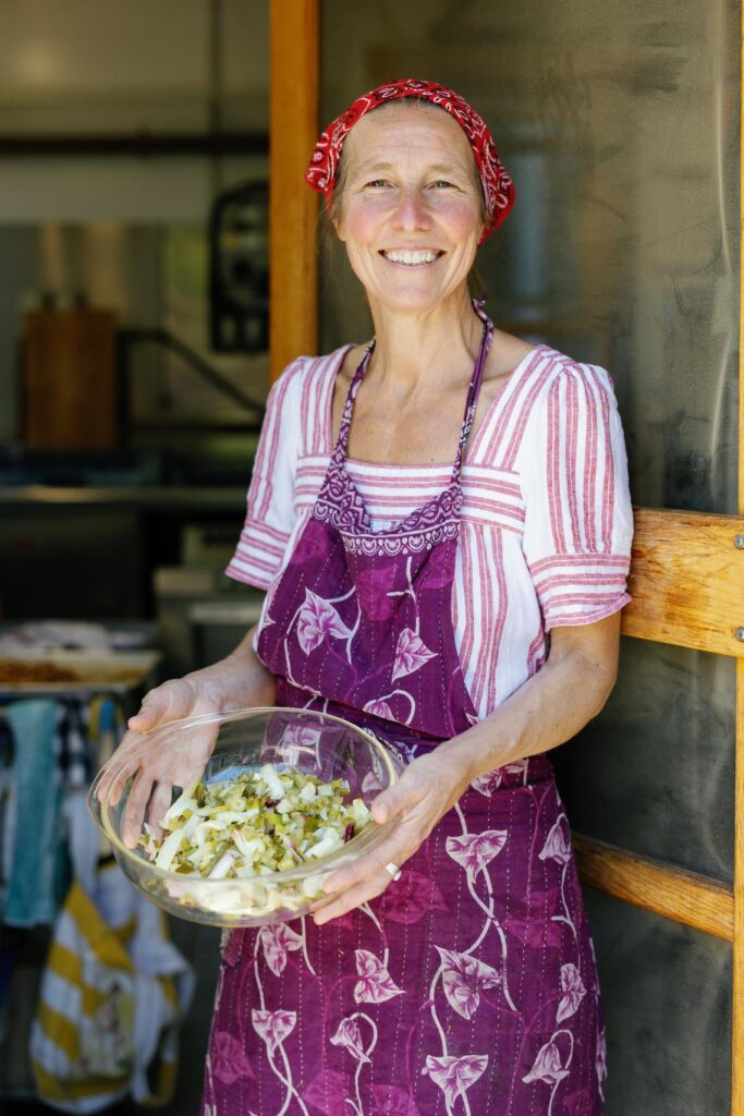 betsy holding a bowl of lettuce