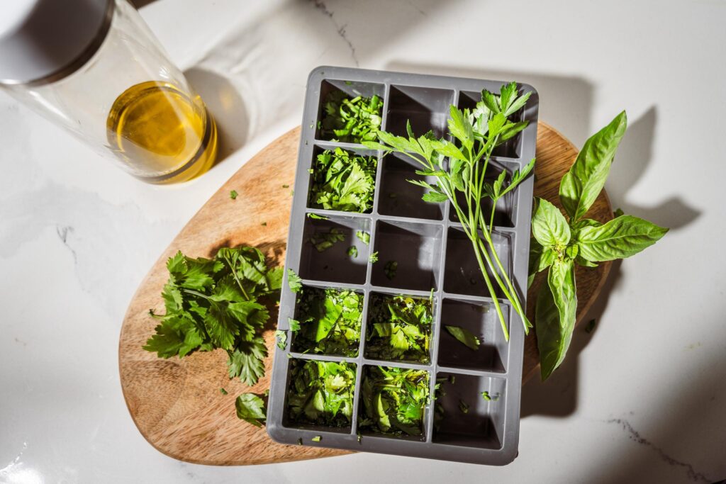 frozen herbs in an ice tray