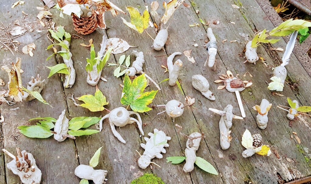 clay sculptures in the shape on animals made by kids