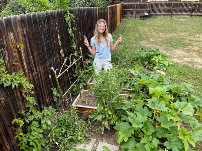 christina using thrifted garden tools