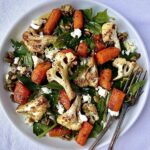 Spinach Salad With Spiced Roasted Carrot and Cauliflower and Candied Pepitas
